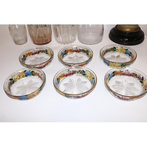 393 - Four glass decanters, max. H30cm; six dessert bowls, each painted with fruit, gilded rims; C19th oil... 