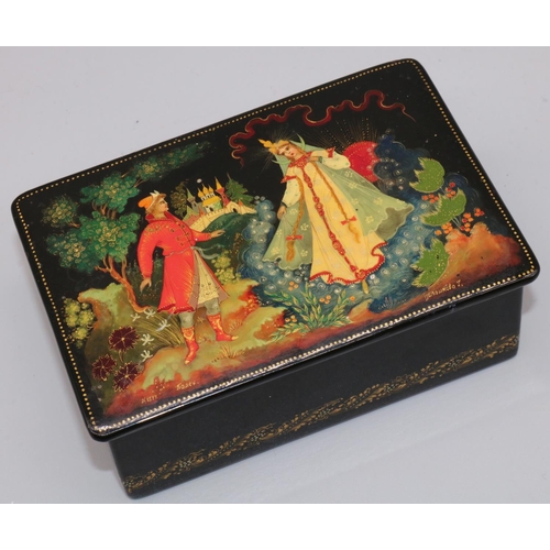 242 - C20th Russian lacquered box decorated with a landscape scene with two figures, hinged cover, signed,... 