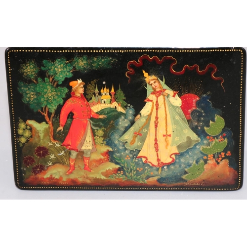 242 - C20th Russian lacquered box decorated with a landscape scene with two figures, hinged cover, signed,... 