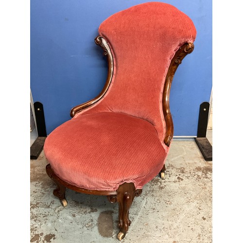 724 - Victorian walnut framed upholstered nursing chair, on moulded cabriole legs and casters, H90cm