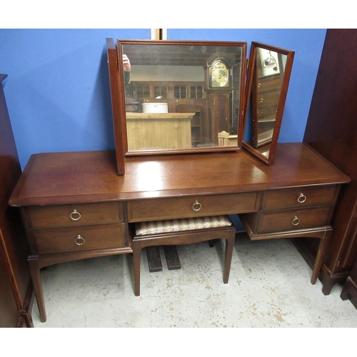 644 - Stag Minstrel bedroom suite comprising; wardrobe W128cm, dressing table, low chest of drawers with m... 