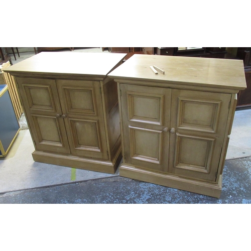 645 - Pair of pine two door cupboards with shelved interiors, on plinth bases with casters, W92cm D60cm H9... 