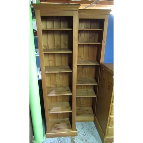 646 - Pair of pine open bookcases, moulded cornice with five adjustable shelves on skirted base, W50cm D28... 