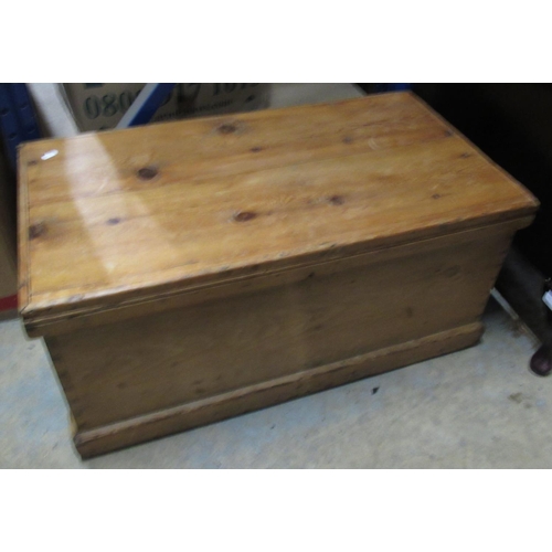 717 - Waxed pine rectangular blanket box, with hinged lid and metal handles on a skirted base, W85cm D46cm... 