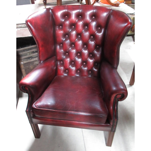 658 - Mill Brook Furnishings Geo. 111 style red leather upholstered wing back arm chair, deep buttoned bac... 