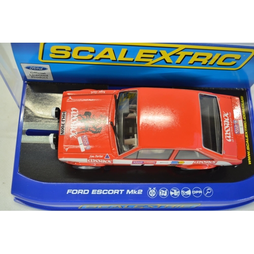 190 - Four Scalextric Ford Escort slot car models to include C3113 MkI Red, C3592 MkI Blue/White, C3416 Mk... 