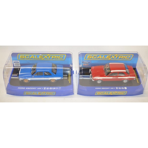 190 - Four Scalextric Ford Escort slot car models to include C3113 MkI Red, C3592 MkI Blue/White, C3416 Mk... 