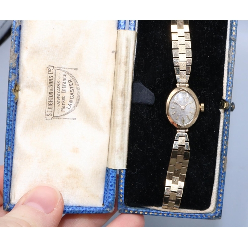 82 - German ladies gold wristwatch on gold box link bracelet, silvered dial with applied Arabic and baton... 