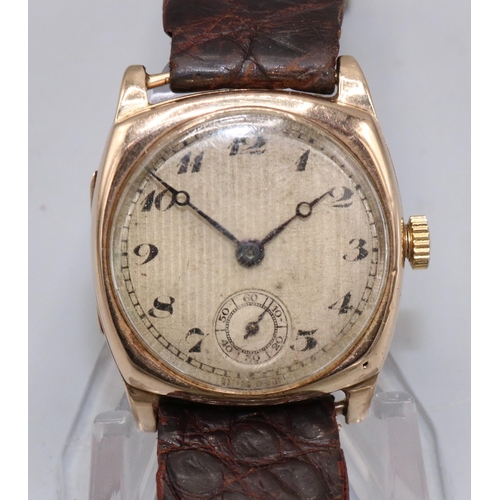 83 - Swiss gold wristwatch, silvered engine turned Arabic dial with subsidiary seconds, cushion case with... 