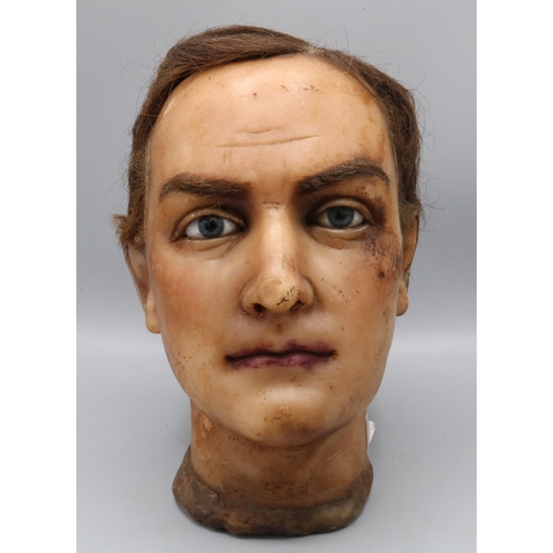 195 - Early C20th male wax mannequin head, with real hair, glass eyes and painted face, c1930s, H25cm