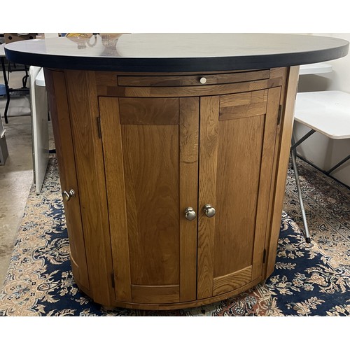 716 - Contemporary oak oval Island kitchen unit, with black granite top on four door base, W116cm D92cm H9... 