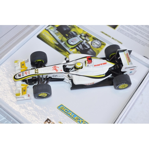 220 - Two Scalextric 1/32 scale Brawn GP Formula 1 racing slot cars to include Commemorative limited editi... 