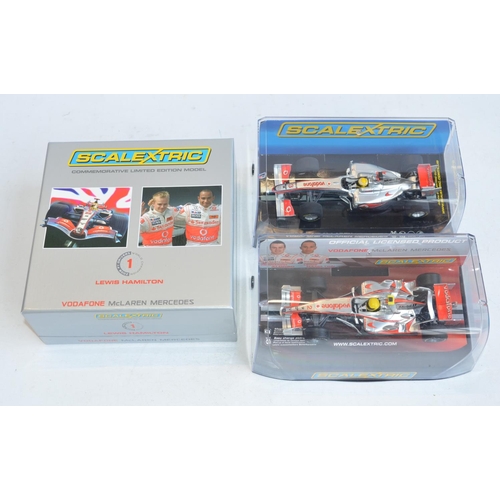 221 - Three Scalextric 1/32 scale Lewis Hamilton McLaren Mercedes Formula 1 racing slot car models to incl... 