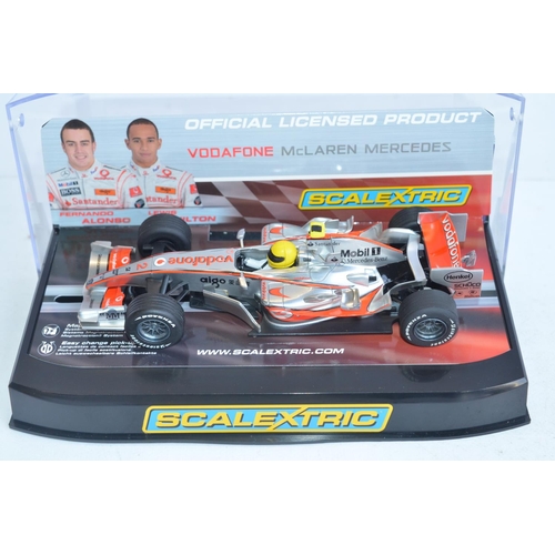 221 - Three Scalextric 1/32 scale Lewis Hamilton McLaren Mercedes Formula 1 racing slot car models to incl... 