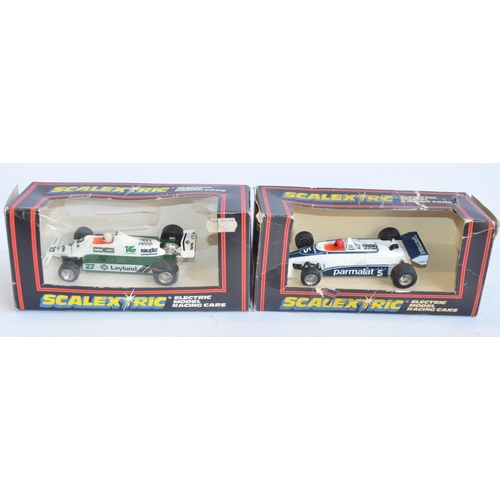 227 - Eight vintage slot racing cars to include Scalextric C129 Green March Ford 240, C426 F1 Williams, (w... 