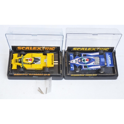 228 - Eight vintage Scalextric Formula 1 slot racing cars to include C129 Blue Rothmans March Ford 240 (so... 