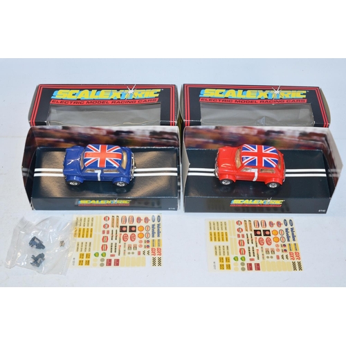 233 - Twelve vintage Scalextric slot cars to include C398 Red Mini (model mint), C399 Blue Mini (model min... 