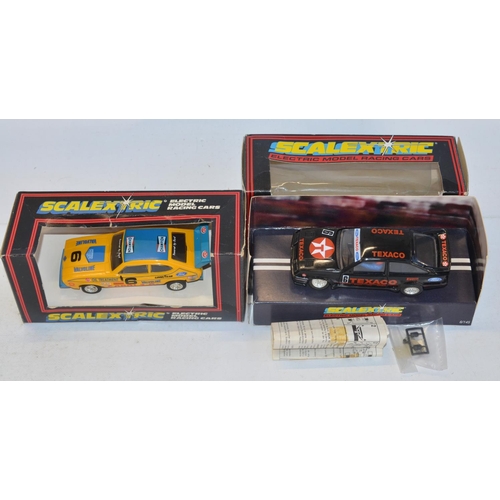 233 - Twelve vintage Scalextric slot cars to include C398 Red Mini (model mint), C399 Blue Mini (model min... 