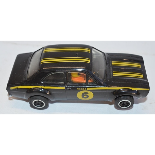 233 - Twelve vintage Scalextric slot cars to include C398 Red Mini (model mint), C399 Blue Mini (model min... 