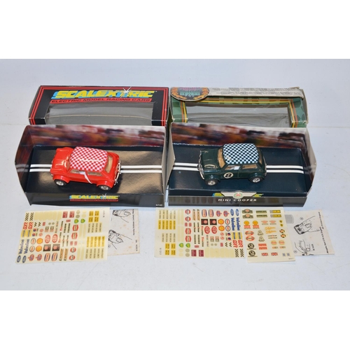 234 - Eleven vintage Scalextric slot car models to include C150 Red Mini Cooper (model mint, box good), C0... 