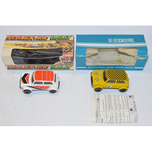 234 - Eleven vintage Scalextric slot car models to include C150 Red Mini Cooper (model mint, box good), C0... 