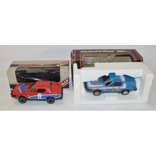 234 - Eleven vintage Scalextric slot car models to include C150 Red Mini Cooper (model mint, box good), C0... 