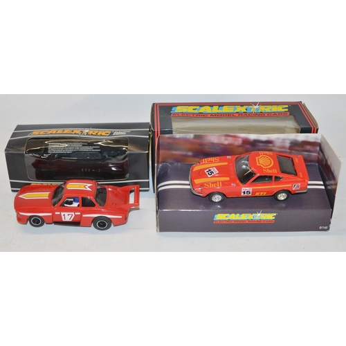 234 - Eleven vintage Scalextric slot car models to include C150 Red Mini Cooper (model mint, box good), C0... 