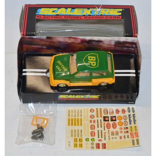 234 - Eleven vintage Scalextric slot car models to include C150 Red Mini Cooper (model mint, box good), C0... 