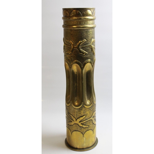 569 - Large Trench Art shell case with floral design. Dated 1910, H50cm