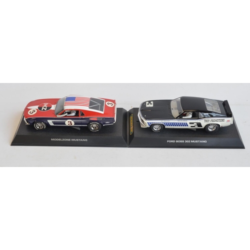 245 - Seven 1/32 scale Ford Mustang slot car racing models from Scalextric to include C2545 