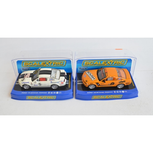 245 - Seven 1/32 scale Ford Mustang slot car racing models from Scalextric to include C2545 