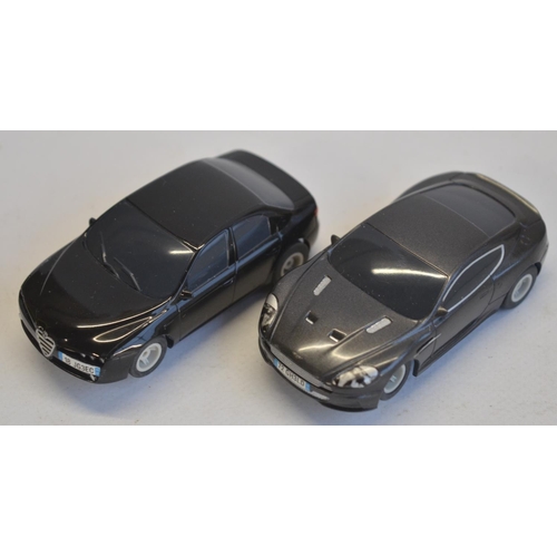 273 - Two Micro Scalextric 1/64 scale James Bond racing slot car sets to include Skyfall (unused/factory s... 