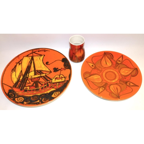 300 - Poole Pottery Delphis - two chargers, one decorated with a ship, and a vase, decorated in orange, ye... 