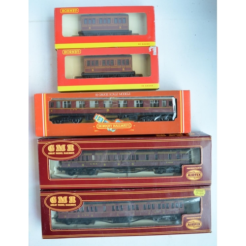 302 - Collection of boxed OO gauge railway passenger and mail coaches to include Hornby, Triang Airfix and... 