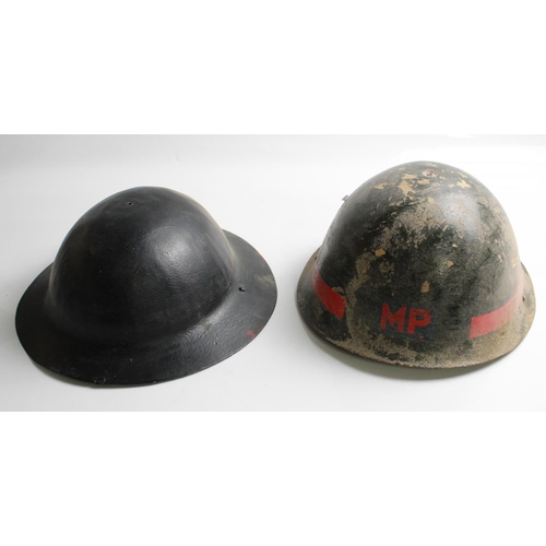 613 - WWI Brody helmet. Original green paint on inside painted black outside, with chin strap lacking line... 