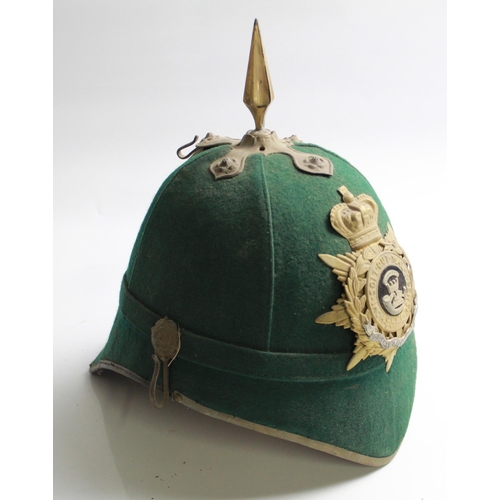 614 - Dark Green cloth military helmet with brass fittings, lacking chin strap, with Somerset Light Infant...