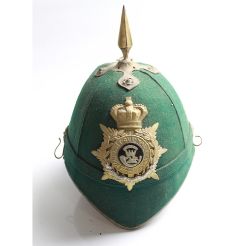 614 - Dark Green cloth military helmet with brass fittings, lacking chin strap, with Somerset Light Infant... 