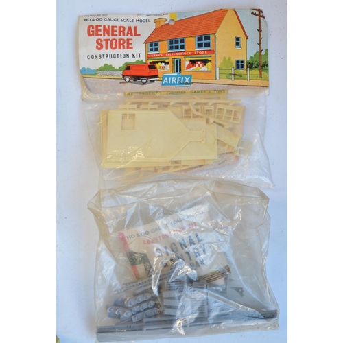 316 - Collection of mostly unbuilt OO, O and TT gauge railway related model kits, mostly plastic but also ... 