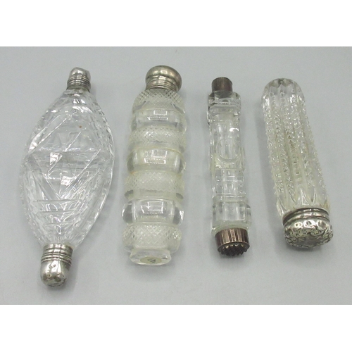 107 - Four late C19th/early C20th cut glass scent bottles incl. two double ended examples, comprising thre... 