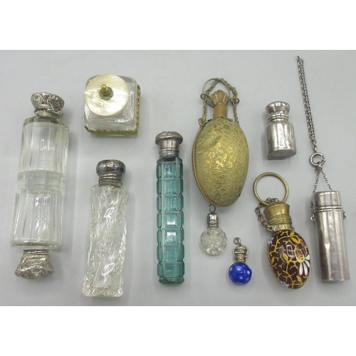 114 - Collection of scent bottles, incl. an egg form pendant bottle with painted enamel decoration, two mi... 