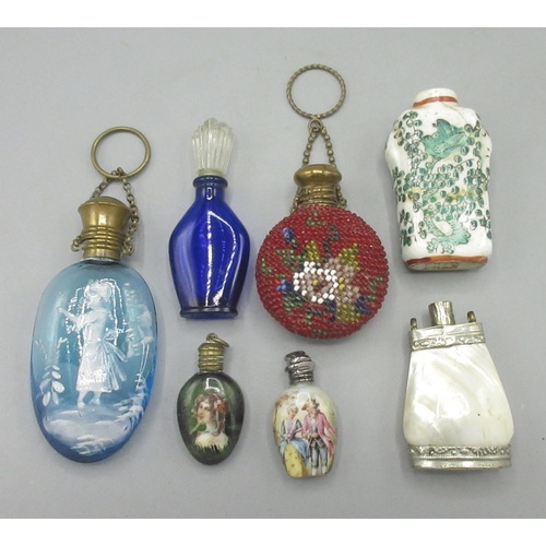 116 - Collection of scent bottles, incl. two porcelain bottles with hallmarked silver tops, a glass bottle... 