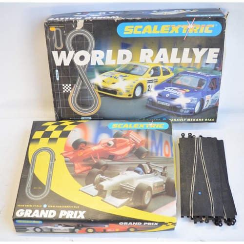 264A - Two boxed Scalextric sets to include C1018 Renault Megane World Rallye and Team Shell/Team Firestone... 