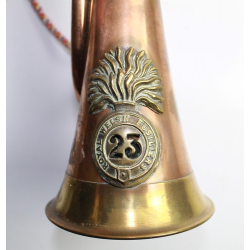 622 - Brass and copper Military bugle with rope 'colours' for the Royal Welsh Fusiliers