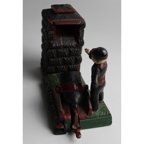 629 - Cast iron money box showing an Artillery officer firing a cannon. THE ARTILLERY BANK