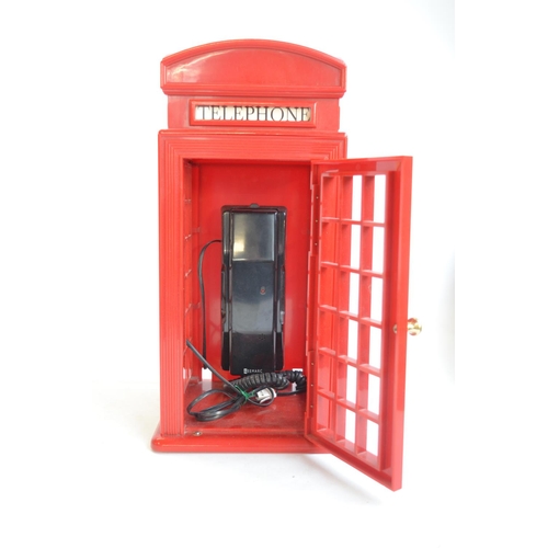 524 - Novelty red telephone box phone by Astral International, 2 clowns and 2 Great War medals to Private ... 