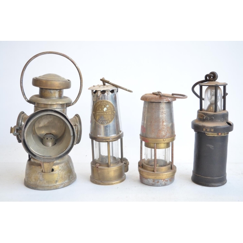 463 - Four vintage metal lamps to include Wolf Safety Lamp, a Type 6 Eccles safety lamp by The Protector L... 