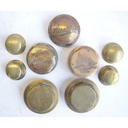 464 - Collection of vintage brass coach and wheel nuts to include Austin, W M Kidd, B Hutchings and W M Wa... 