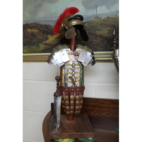 610 - Detailed model of a Roman Centurion with Gladius on stand. 54cm.  A Greek soldier with shield and sw... 