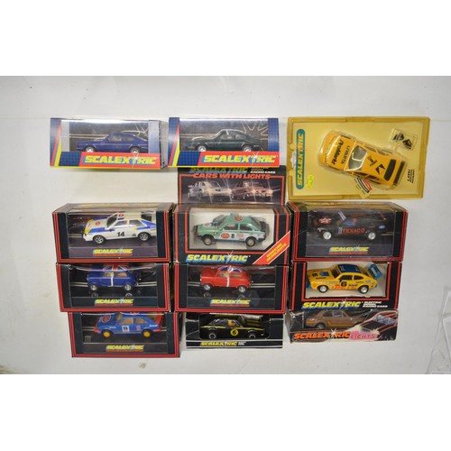 233 - Twelve vintage Scalextric slot cars to include C398 Red Mini (model mint), C399 Blue Mini (model min... 