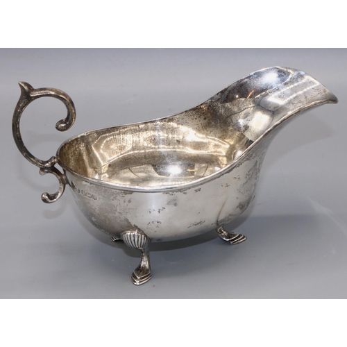 149 - Art Deco Silver sauce boat with scalloped edges and a sweeping curved handle, Sheffield, 1927, John ... 